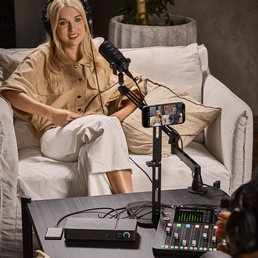 Podcaster using an iPhone as a camera with RØDE Capture and the RØDECaster Video Core